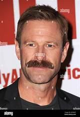 Unveiling the Intriguing Dynamics of Aaron Eckhart's Relationships